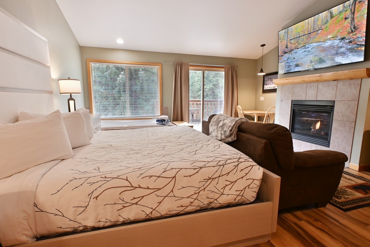 Stunning living room with huge smart tv and gas fireplace.