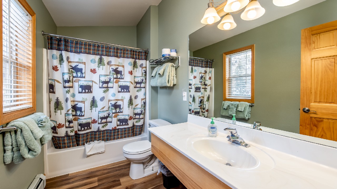 Luxurious vanity and sink in a Riverview Suite condo bathroom in Estes Park